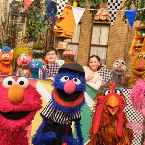 This image released by Sesame Workshop shows muppet characters Elmo, left, Grover, second left, and Abby, right, from the "Sesame Street" episode "Elmo Runs the Race." (Zach Hyman/Sesame Workshop via AP)