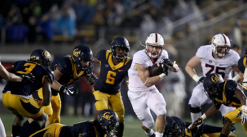 Stanford running back Christian McCaffrey, shown here playing against California, has decided to skip his team's bowl game to prepare for the NFL draft. (Ezra Shaw/Getty Images)