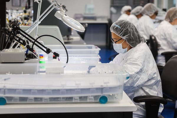 An employee at Femasys, which makes contraceptive and fertility products, works at the company's 50,000-square-foot manufacturing facility in Suwanee on Wednesday, Sept. 24, 2025. (Abbey Cutrer/AJC) 