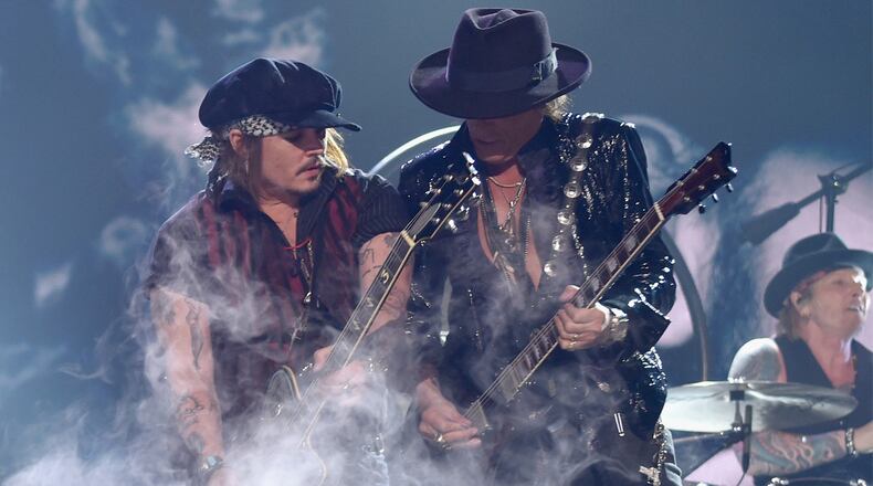 Actor/musician Johnny Depp (L) and musician Joe Perry of Hollywood Vampires perform onstage during The 58th GRAMMY Awards at Staples Center on February 15, 2016 in Los Angeles, California. (Photo by Larry Busacca/Getty Images for NARAS)