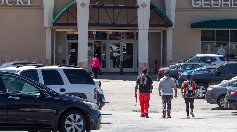 People make their way into the Greenbriar Mall in southwest Atlanta on Friday, May 1, 2020. STEVE SCHAEFER / SPECIAL TO THE AJC