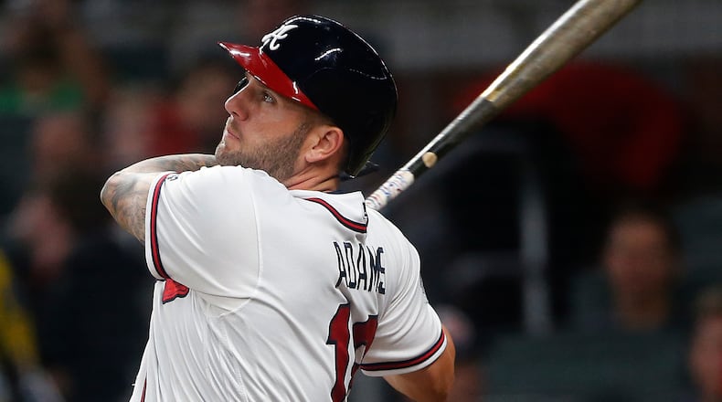 Atlanta Braves first baseman Matt Adams follows though on a solo home run during the fourth inning of the team’s baseball game against the San Francisco Giants on Thursday, June 22, 2017, in Atlanta. (AP Photo/John Bazemore)