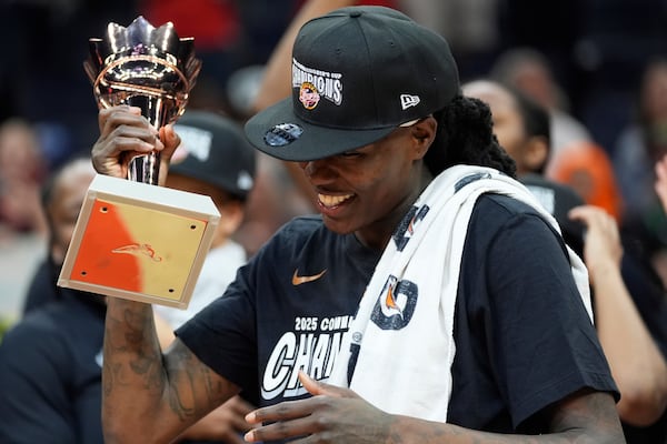 Indiana Fever forward Natasha Howard (6) celebrates after being named WNBA Commissioner's Cup MPV following the championship basketball game against the Minnesota Lynx, Tuesday, July 1, 2025, in Minneapolis. (AP Photo/Abbie Parr)