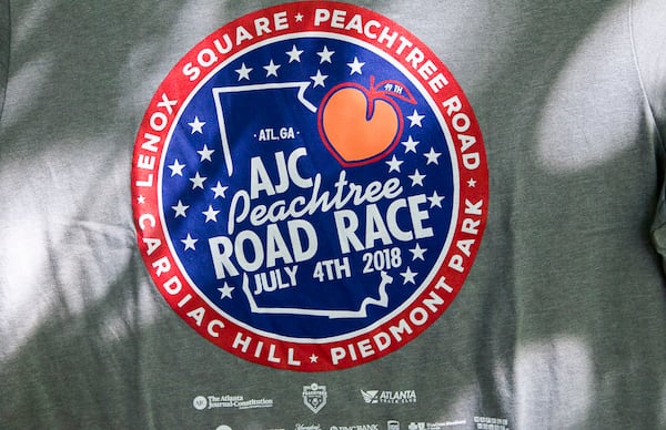 07/03/2018 -- Atlanta, GA - The official 2018 Peachtree Road Race t-shirt is revealed at the Park Tavern, Tuesday, July 3, 2018. ALYSSA POINTER/ALYSSA.POINTER@AJC.COM