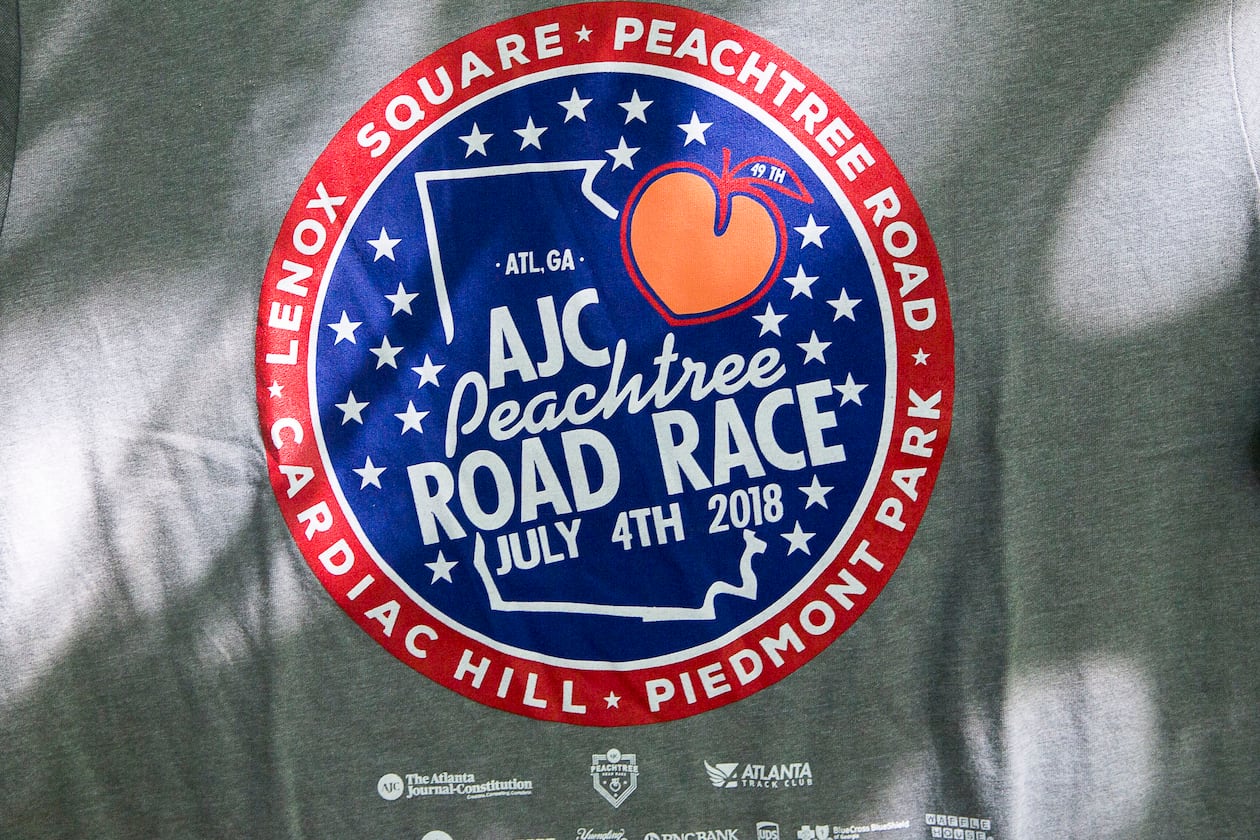 07/03/2018 -- Atlanta, GA - The official 2018 Peachtree Road Race t-shirt is revealed at the Park Tavern, Tuesday, July 3, 2018. ALYSSA POINTER/ALYSSA.POINTER@AJC.COM