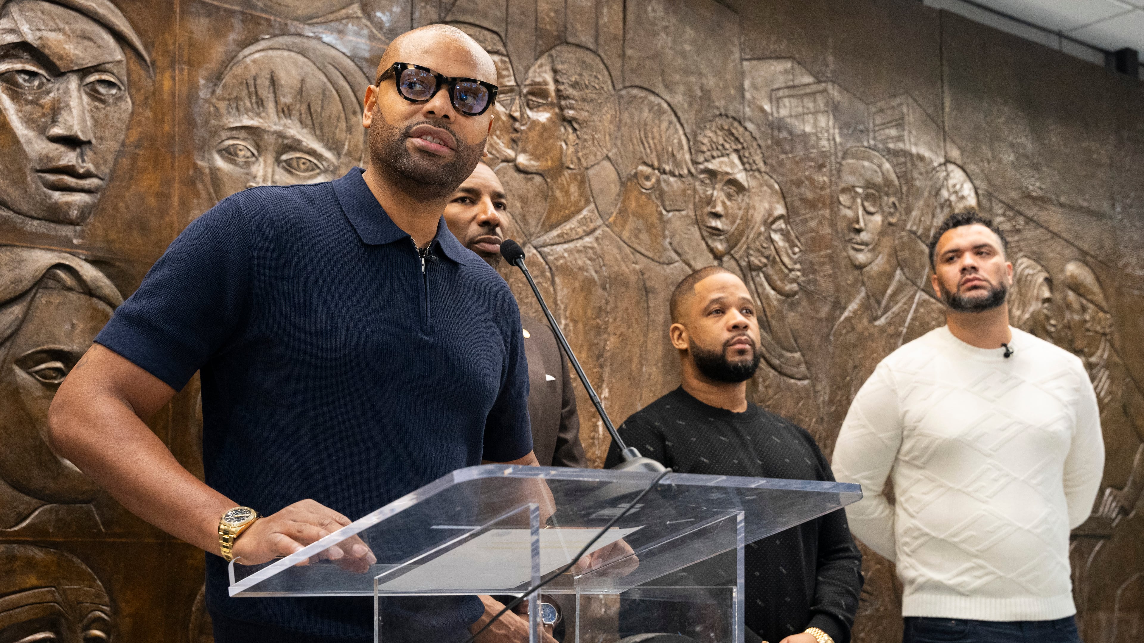 Rashad Bilal, co-founder of Earn Your Leisure and Invest Fest, announces the details for last year's Invest Fest at Atlanta City Hall on Friday, March 22, 2024. (Olivia Bowdoin for the AJC)