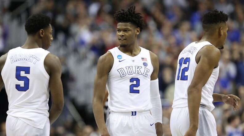 RJ Barrett (5), Cam Reddish (2) and Javin DeLaurier (12) of the Duke Blue Devils celebrate a basket against the Michigan State Spartans during the second half in the East Regional game of the 2019 NCAA Men's Basketball Tournament at Capital One Arena on March 31, 2019 in Washington, DC. (Photo by Rob Carr/Getty Images)