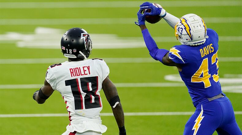 Los Angeles Chargers cornerback Michael Davis (43) intercepts a pass intended for Atlanta Falcons wide receiver Calvin Ridley (18) during the second half Sunday, Dec. 13, 2020, in Inglewood, Calif. (Ashley Landis/AP)