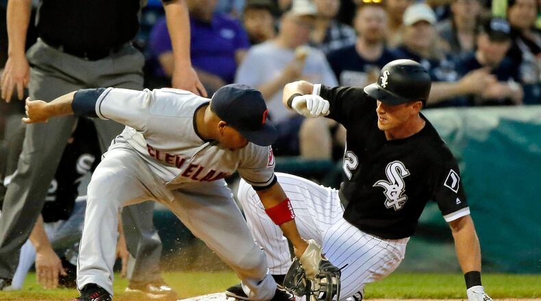 CHICAGO, IL - JUNE 13: Charlie Tilson #22 of the Chicago White Sox beats the tag of Jose Ramirez #11 of the Cleveland Indians for an RBI triple during the fifth inning at Guaranteed Rate Field on June 13, 2018 in Chicago, Illinois. (Photo by Jon Durr/Getty Images)