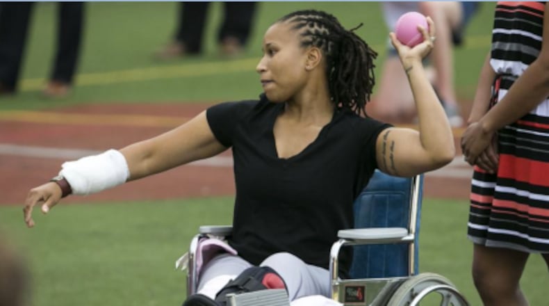 Injured police office Crystal Griner threw the first pitch at Wednesday’s Congressional Women’s Softball game in Washington, D.C. June 21, 2017. (Al Drago/The New York Times)