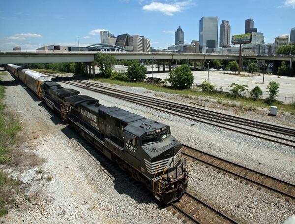 INSIDE LEDE

May 28, 2013 - Atlanta, Ga: A Norfolk-Southern train travels south close to the Mitchell Street bridge in the Gulch Tuesday afternoon in Atlanta, Ga., May 28, 2013. The Norfolk-Southern route runs north-south through downtown beneath the Georgia World Congress Center (GWCC), through the Gulch, and then onward to parallel MARTA's Red/Gold lines south of downtown. JASON GETZ / JGETZ@AJC.COM
