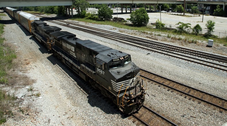 A Norfolk Southern train travels south close to the Mitchell Street bridge in the Gulch in Atlanta on May 28, 2013.