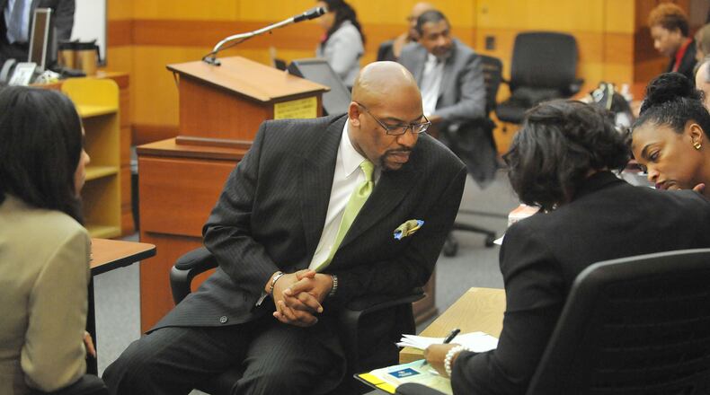 Fulton County Senior Assistant DA Clint Rucker consults the prosecution team about a response to a question from the jury about evidence from Dunbar Elementary School on Tuesday, the seventh day of jury deliberations in the Atlanta Public Schools test-cheating trial. (Atlanta Journal-Constitution, Kent D. Johnson, Pool)
