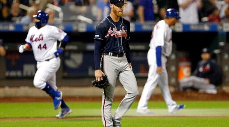 Atlanta Braves pitcher Mike Foltynewicz reacts after giving up a two-run home run to New York Mets' Rene Rivera (44) during the third inning of a baseball game, Saturday, Sept. 28, 2019, in New York. (AP Photo/Adam Hunger)