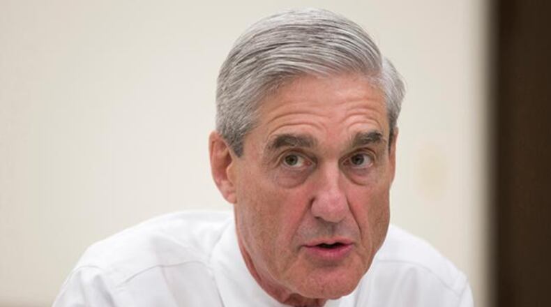 In an Aug. 21, 2013 file photo, outgoing FBI director Robert Mueller speaks during an interview at FBI headquarters, in Washington. Muller, the special counsel investigating possible ties between President Donald Trump's campaign and Russia's government has taken over a separate criminal probe involving former Trump campaign chairman Paul Manafort, and may expand his inquiry to investigate the roles of the attorney general and deputy attorney general in the firing of FBI Director James Comey, The Associated Press has learned.
