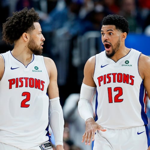 Detroit Pistons forward Tobias Harris (12) reads to a basket scored against the Orlando Magic by guard Cade Cunningham (2) during the second half in Game 5 of a first-round NBA basketball playoffs series Wednesday, April 29, 2026, in Detroit. (AP Photo/Duane Burleson)