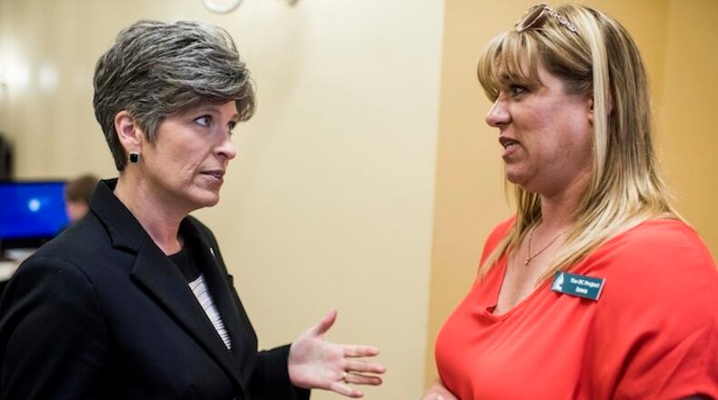 (L-r) Sen. Joni Ernst, R-Iowa, speaks to a Iowian concerning healthcare issues in Ernst's Capitol Hill office in Washington, D.C., in July. MUST CREDIT: Washington Post photo by Melina Mara