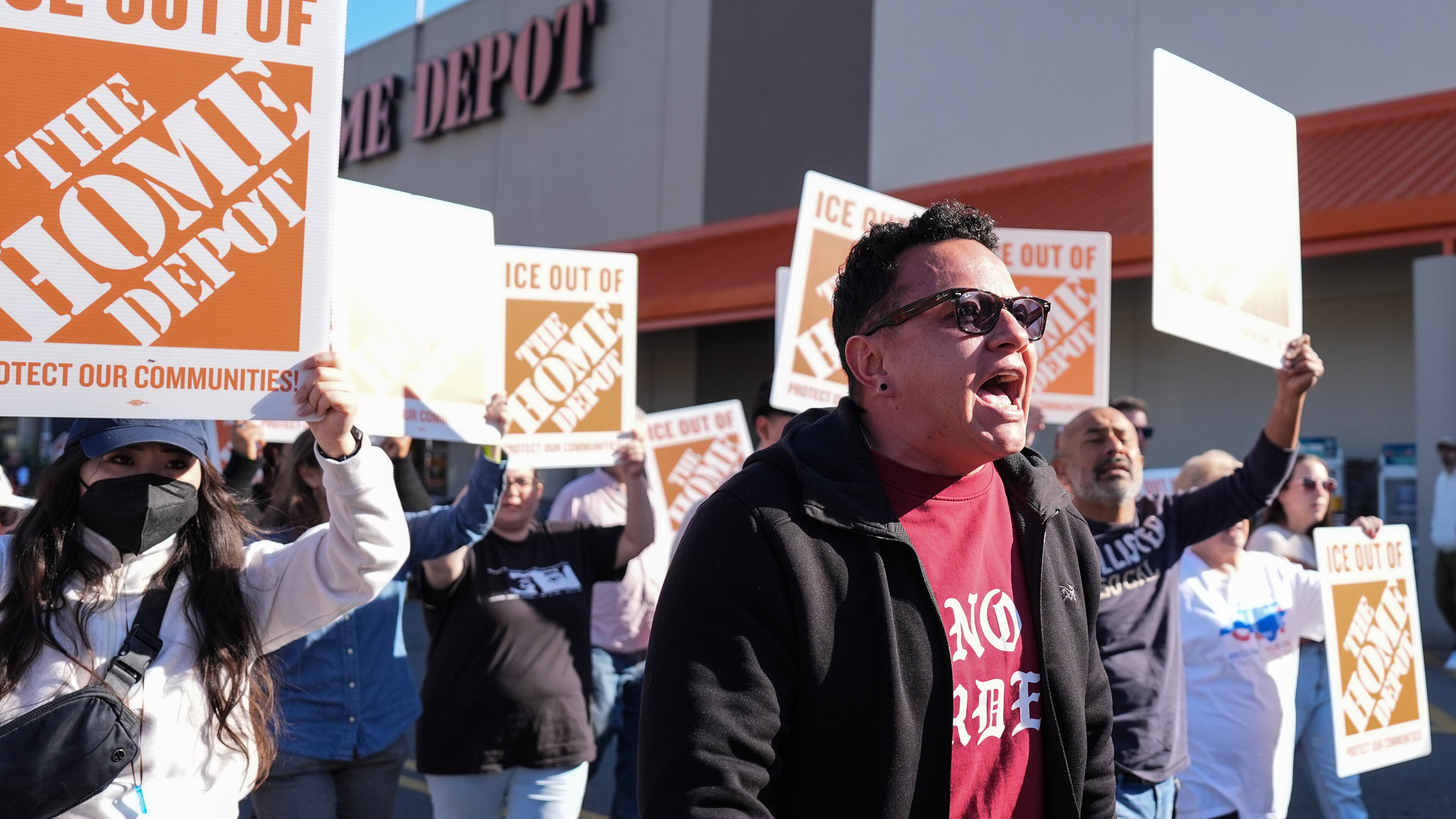 Organizing director for the National Day Laborer Organizing Network Jorge Torres, center, marches alongside protestors outside of a Home Depot, Wednesday, Nov. 19, 2025, in Charlotte, N.C. (AP Photo/Matt Kelley)