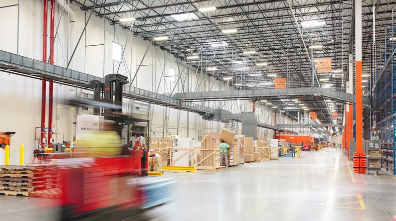 Warehouses are hiring, but it hasn't made up for the cutbacks in other sectors, especially hospitality. Here the inside of a 1.1 million-square-foot, Home Depot distribution center in Locust Grove.