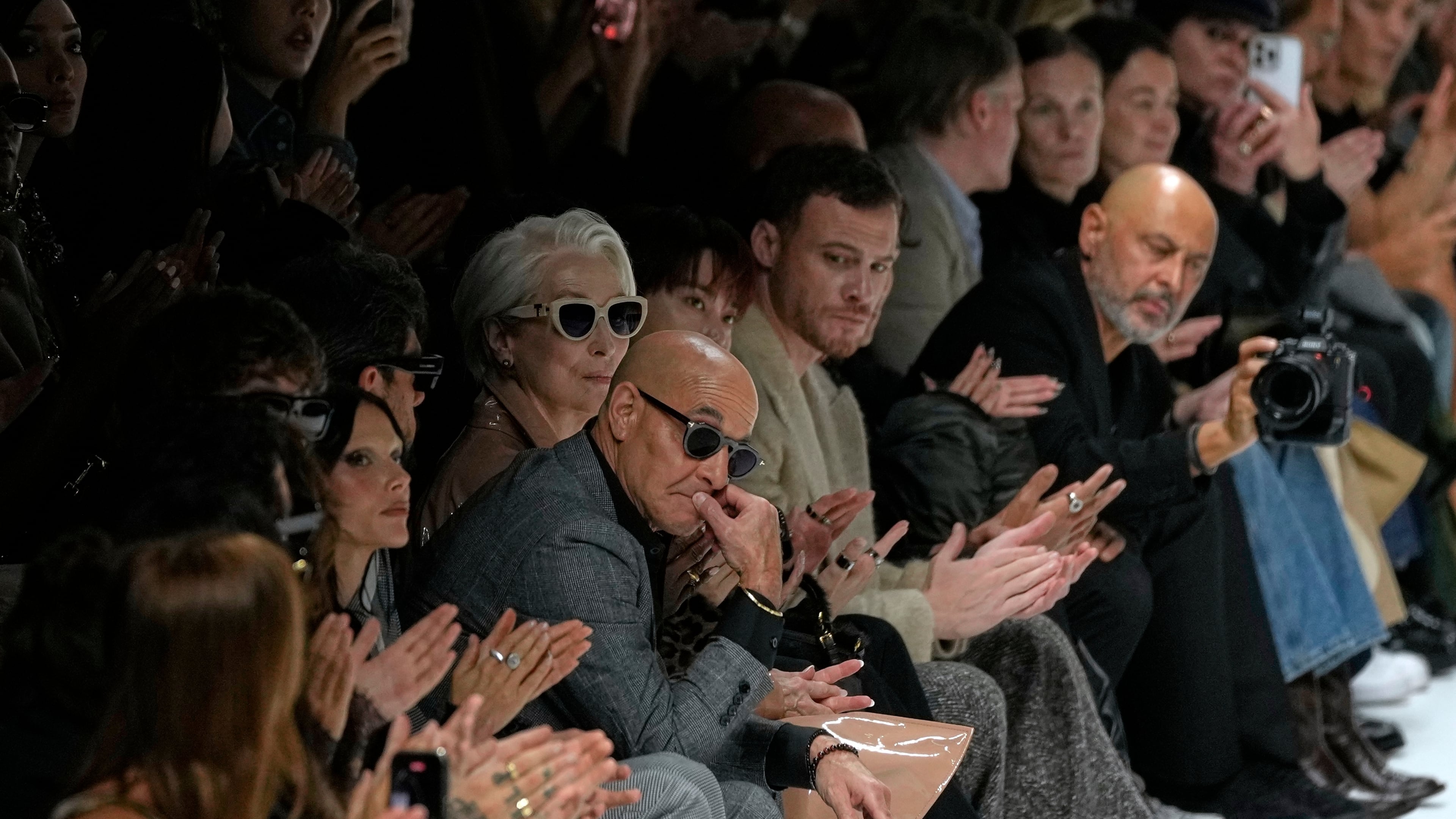 Stanley Tucci, centre left, and Meryl Streep, centre right, attend the Dolce & Gabbana Spring/Summer 2026 collection presented in Milan, Italy, Saturday, Sept. 27, 2025. (AP Photo/Luca Bruno)