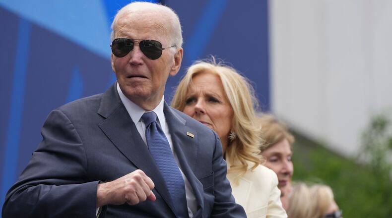From l-r., former President Joe Biden, former first lady Jill Biden, former first lady Laura Bush and former Secretary of State Hillary Clinton on stage during the dedication ceremony for the Obama Presidential Center, Thursday, June 18, 2026, in Chicago. (AP Photo/Alex Brandon)