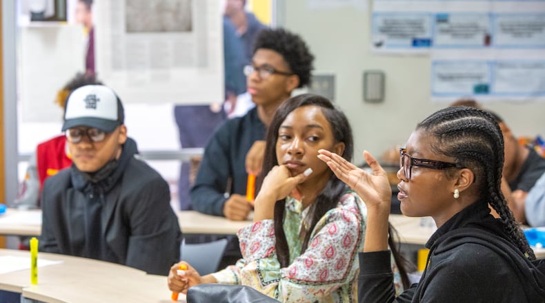 Students participate in an Advanced Placement African American Studies class at Maynard Jackson High School on Friday, Feb 17, 2023, when the class was a pilot in Georgia. Students discussed historic and current events, presented class projects and considered why restrictions are being put on the course in other states. (Jenni Girtman for The Atlanta Journal-Constitution)