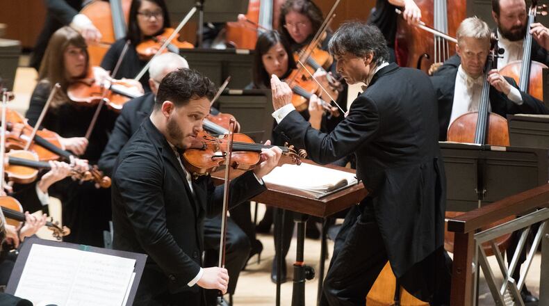 Guest conductor Jun Markl leads the Atlanta Symphony Orchestra and Giora Schmidt in the Vieuxtemps Violin Concerto No. 5. CONTRIBUTED BY JEFF ROFFMAN