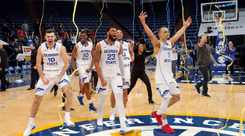 Georgia State celebrates their victory over Texas-Arlington in the Sun Belt Conference NCAA college basketball championship game in New Orleans, Sunday, March 11, 2018. Georgia State won 74-61. (AP Photo/Gerald Herbert)