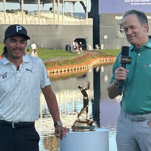 This photo provided by NBC Sports shows NBC Sports announcer Dan Hicks, right, interviewing Rickie Fowler during The Players Championship golf tournament at TPC Sawgrass in Ponte Vedra Beach, Fla., March 2026. (Dan Masonson/NBC Sports via AP)