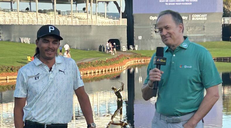 This photo provided by NBC Sports shows NBC Sports announcer Dan Hicks, right, interviewing Rickie Fowler during The Players Championship golf tournament at TPC Sawgrass in Ponte Vedra Beach, Fla., March 2026. (Dan Masonson/NBC Sports via AP)
