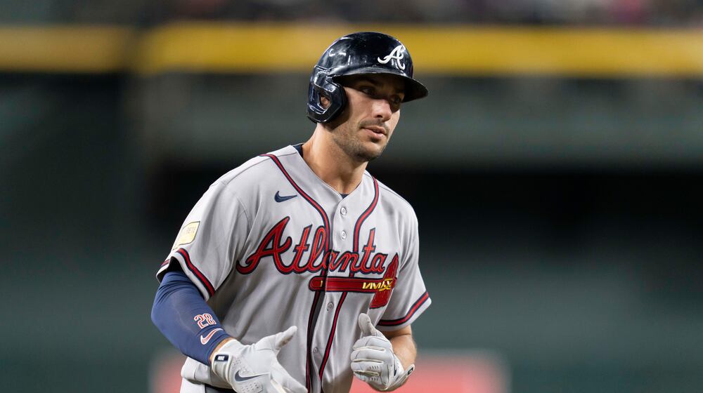 Atlanta Braves first baseman Matt Olson (28) rounds the bases after hitting a home run during the ninth inning of a baseball game against the Arizona Diamondbacks, Friday, April 3, 2026, in Phoenix. (AP Photo/Rebecca Noble)