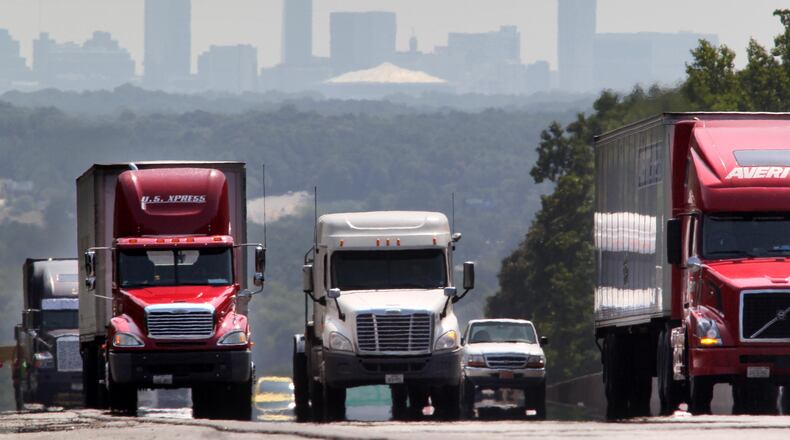The hazy Atlanta skyline looms over I-20 motor traffic as it moves westward past Riverside Parkway while Atlanta reached a code orange smog alert for the fifth day in a row Thursday, Aug. 12, 2010.