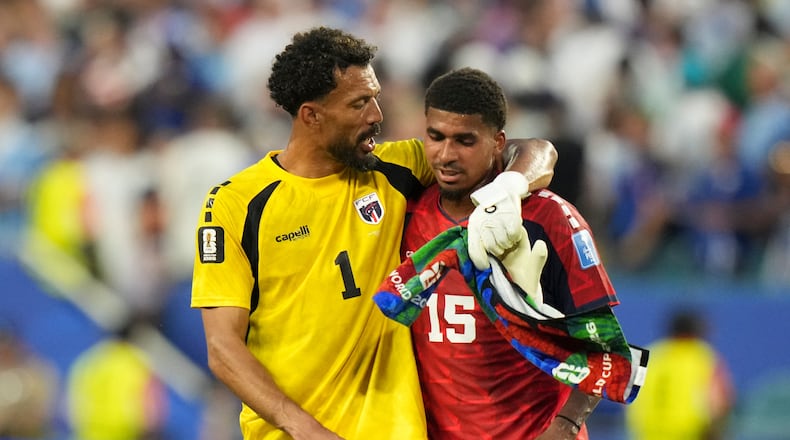 Cape Verde goalkeeper Vozinha, left, and Laros Duarte react at the end of the World Cup Group H soccer match between Uruguay and Cape Verde in Miami Gardens, Fla., Sunday, June 21, 2026. (AP Photo/Lynne Sladky)