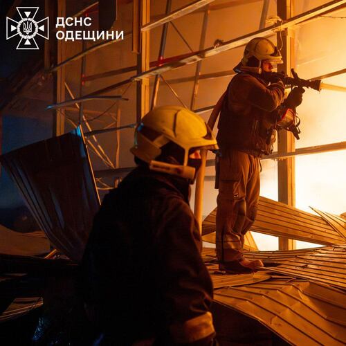 In this photo provided by the Ukrainian Emergency Service, emergency services personnel work to extinguish a fire following a Russian attack in Odesa region, Ukraine, Thursday, Jan. 29, 2026. (Ukrainian Emergency Service via AP)