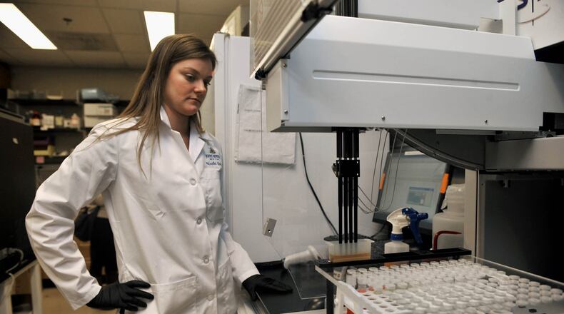 Research specialist Nicole Quinn of Johns Hopkins Medicine tests samples for sexually transmitted diseases in a February 15, 2011, file image. (Kim Hairston/Baltimore Sun/TNS)
