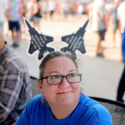 FILE - Christy Williams greets people at the voting check-in table where International Association of Machinists and Aerospace Workers union members picked up their ballot in Maryland Heights, Mo., Sept. 12, 2025, to vote on a negotiated tentative labor agreement that would end their strike against Boeing Defense St. Louis regional operations. (David Carson/St. Louis Post-Dispatch via AP, File)