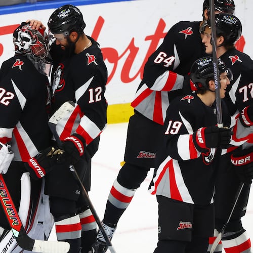 Buffalo Sabres players celebrate after a victory over the Columbus Blue Jackets in an NHL hockey game Thursday, April 9, 2026, in Buffalo, N.Y. (AP Photo/Jeffrey T. Barnes)