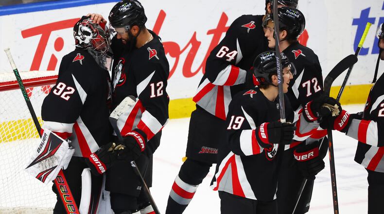 Buffalo Sabres players celebrate after a victory over the Columbus Blue Jackets in an NHL hockey game Thursday, April 9, 2026, in Buffalo, N.Y. (AP Photo/Jeffrey T. Barnes)