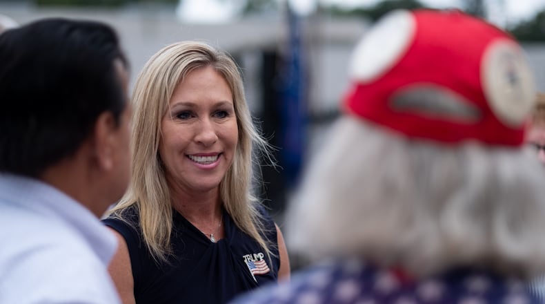 200829-Rome-Marjorie Taylor Greene, a Republican running to represent Georgia’s 14th congressional district, talks with supporters Saturday morning August 29, 2020 at a political rally at the Rome fairgrounds. Ben Gray for the Atlanta Journal-Constitution