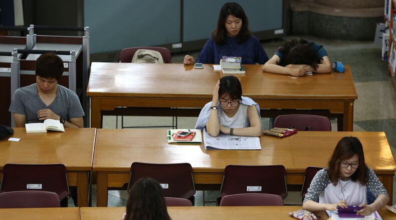 Students study at a school campus library in Seoul, South Korea