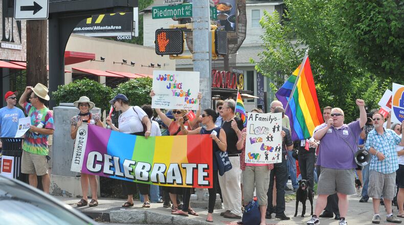 Atlantans rally in support of gay rights after the Supreme Court overturned the Defense of Marriage Act and rejected an appeal of the California marriage ban.