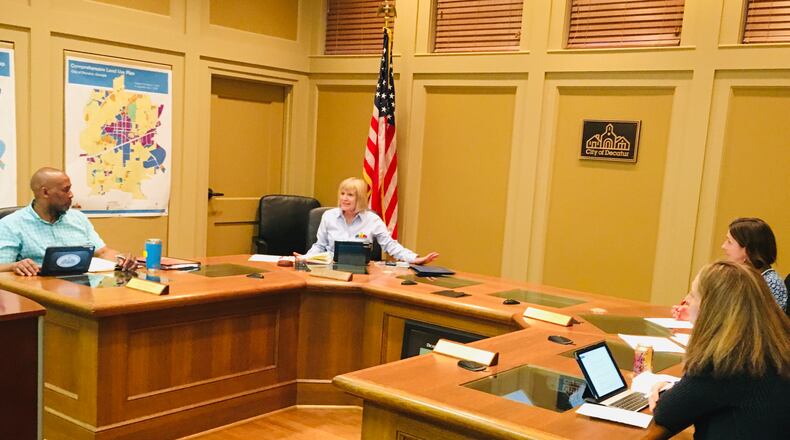 To maintain so-called “social distancing” only three of Decatur’s five commissioners were present during Monday’s meeting, l-r Mayor Pro Tem Tony Powers, Mayor Patti Garrett, City Manager Andrea Arnold and commissioner Kelly Walsh. Bill Banks for the AJC