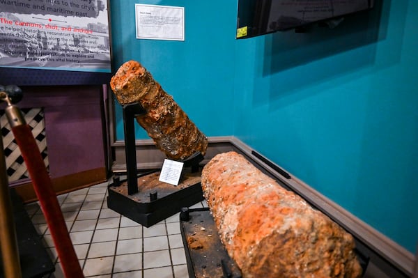Two unrestored Revolutionary War era cannons of the 19 found in the Savannah River during a dredging project in 2021 are on display at the Savannah History Museum. (Sarah Peacock for the AJC)