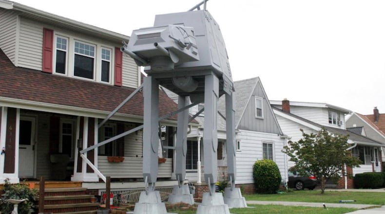 This Thursday, Oct. 12, 2017 photo shows a replica four-legged All Terrain Armored Transport, or AT-AT walker in Parma, Ohio. Owner Nick Meyer tells Cleveland.com he used wood, hard foam and plastic barrels. He says he enjoys the "Star Wars" movies but isn't a fanatic and simply thought the display would be unique. (Patrick Cooley/The Plain Dealer-Cleveland.com via AP)