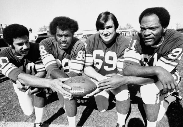 FILE - This Jan. 9, 1975, file photo shows from left, Minnesota Vikings defensemen Jim Marshall, Alan Page, Doug Sutherland and Carl Eller nicknamed the "Purple People Eaters" for their bruising defensive line from the late 1960s through the 1970s. (AP Photo/File)