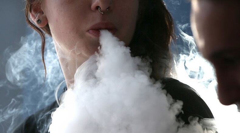 An ordinance that would ban vape shops has been accepted on first reading by the Alpharetta City Council. AJC FILE/JUSTIN SULLIVAN/GETTY IMAGES