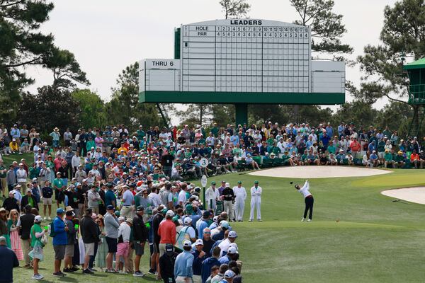 With the scoreboard in the background, amateur Mason Howell hits his tee shot on the third hole during a practice round at the Masters on Monday, April 6, 2026, in Augusta. (Jason Getz/AJC) 