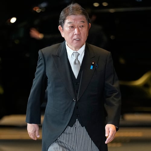 Toshimitsu Motegi, newly appointed foreign minister, arrives at the prime minister's office in Tokyo, Japan, Tuesday, Oct. 21, 2025.(AP Photo/Eugene Hoshiko)