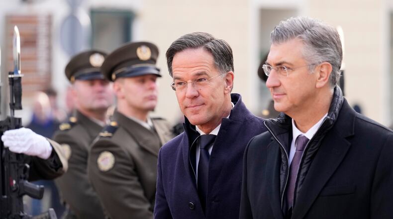 NATO Secretary General Mark Rutte, center, is welcomed by Croatian Prime Minister Andrej Plenkovic, in Zagreb, Croatia, Monday, Jan. 12, 2026. (AP Photo/Darko Bandic)