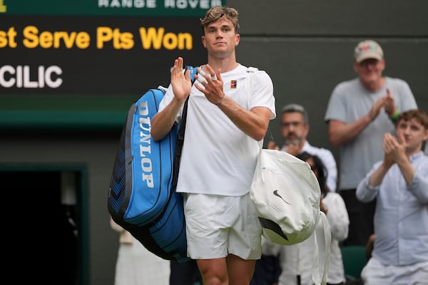 Jack Draper of Britain reacts after losing his second round men's singles match against Marin Cilic of Croatia at the Wimbledon Tennis Championships in London, Thursday, July 3, 2025.(AP Photo/Kin Cheung)